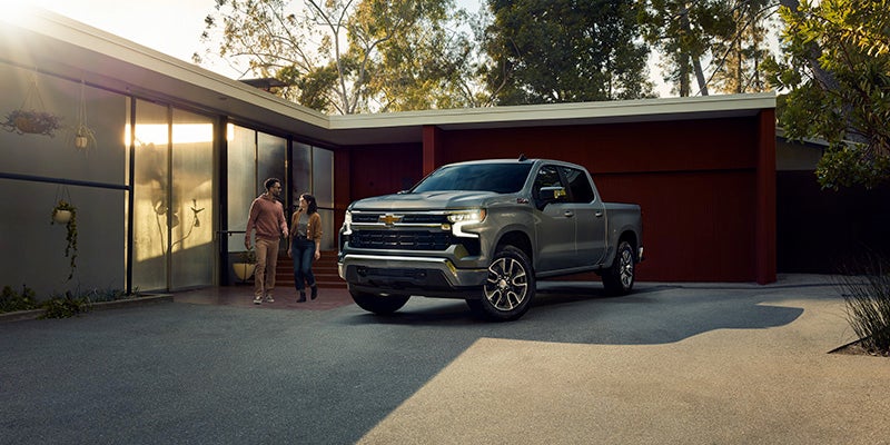 Chevy Silverado 1500 parked outside modern house
